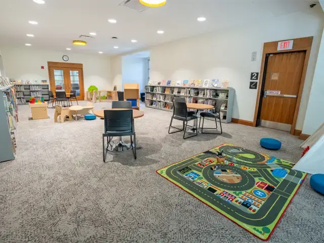 Image of the Family Study Space with toys, picture books, and child-size and adult-sized furniture