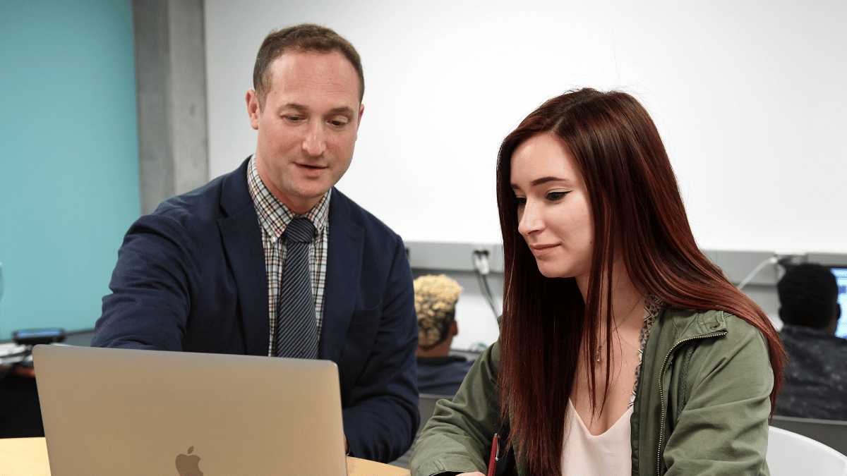 Image of Librarian Assisting a Student